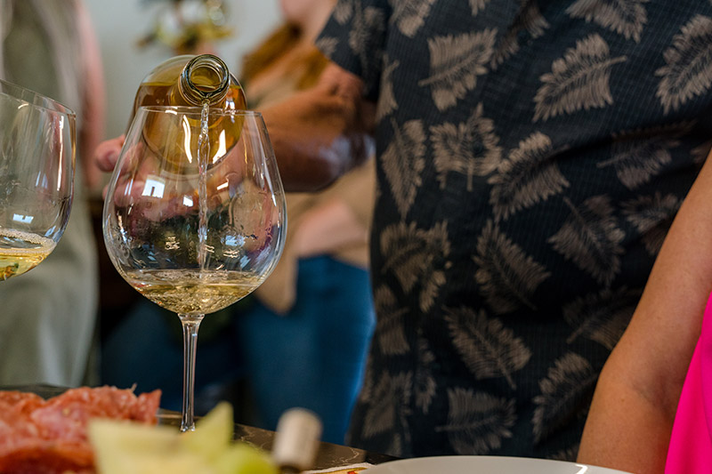 pouring wine into a glass